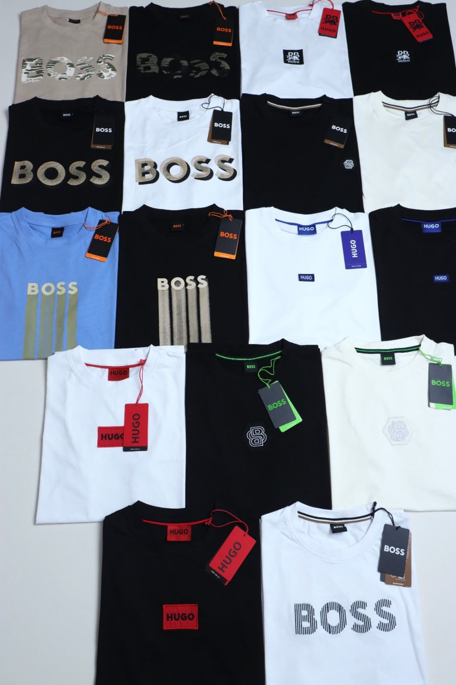 Playeras Hugo y Boss de distintos modelos y colores, dobladas y acomodadas juntas